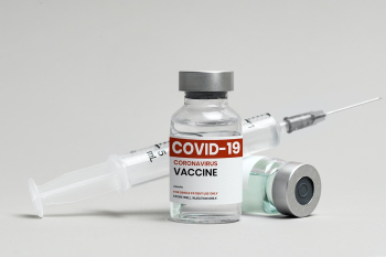 COVID-19 vaccine injection glass vial with syringe COVID-19 vaccine injection glass vial with syringe