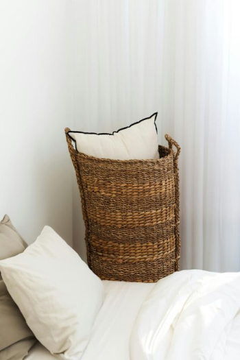 Cozy Bedroom Corner with Woven Basket Cozy Bedroom Corner with Woven Basket