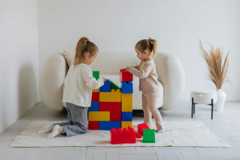 Creative Playtime: Children Building with Colorful Blocks Creative Playtime: Children Building with Colorful Blocks