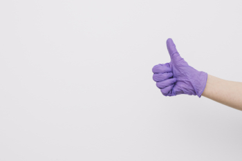 Crop hand gesturing thumb-up Crop hand gesturing thumb-up