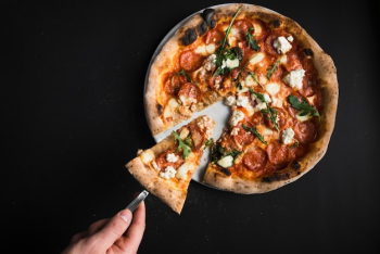 Crop hand taking piece of pizza Crop hand taking piece of pizza