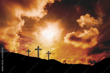 Cross religion symbol shape over sunset sky Cross religion symbol shape over sunset sky