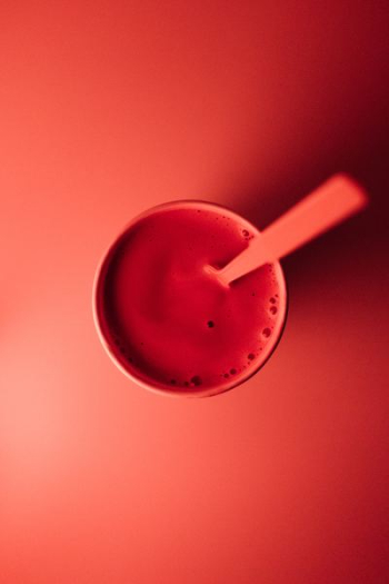 cup with brown liquid and spoon cup with brown liquid and spoon