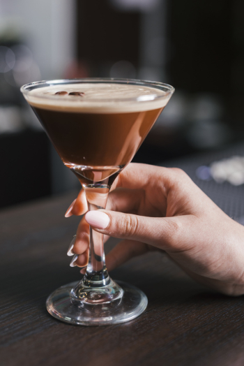 Customer enjoying an alcoholic drink Free Photo