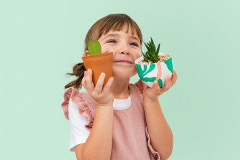 Cute girl with plants kid studio shoot | Free stock photo | High Resolution image