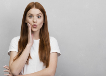 Cute woman puckering lips studio shot Free Photo Cute woman puckering lips studio shot Free Photo