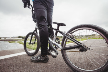 Cyclist standing with bmx bike at starting ramp Free Photo