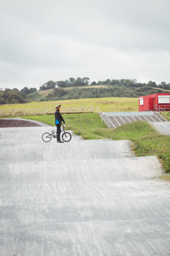 Cyclist standing with bmx bike Free Photo