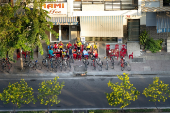 Cyclists Standing on Sidewalk Cyclists Standing on Sidewalk