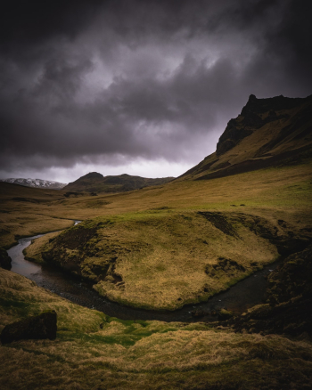 Dark skies over a river bend in Iceland. Dark skies over a river bend in Iceland.