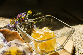 Delicious and natural raw honeycomb on a snack board 