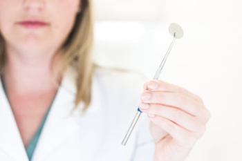 Dentist Holding Dental Tool Dentist Holding Dental Tool
