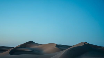 desert under blue sky desert under blue sky