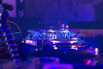 DJ controller in dimmed room DJ controller in dimmed room