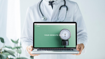 Doctor holding laptop mockup for website Free Psd