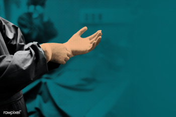 Doctor putting on a glove to prevent coronavirus contamination | Free  photo - 2302251