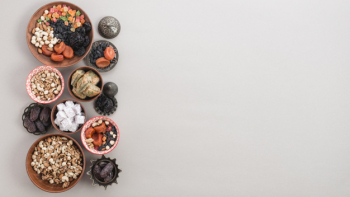 Dried fruits; nuts; dates; lukum and baklava on white background with space for writing the text