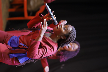 Dynamic Female Vocalist Performing on Stage