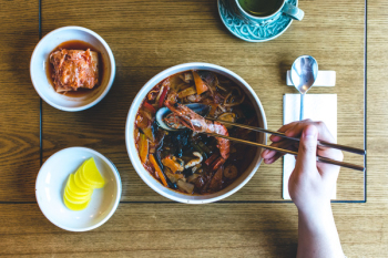 Eating Korean seafood stew Eating Korean seafood stew