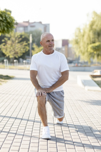 Elder man stretching out outdoors Free Photo Elder man stretching out outdoors Free Photo