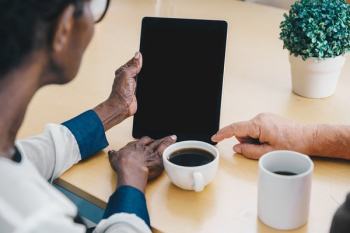 Elderly Hands Holding iPad Elderly Hands Holding iPad