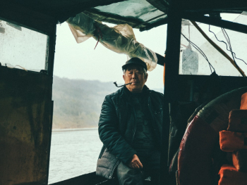Elderly Man Sitting on Boat Elderly Man Sitting on Boat