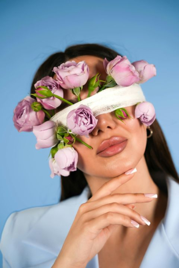 Elegant Woman with Floral Blindfold Elegant Woman with Floral Blindfold