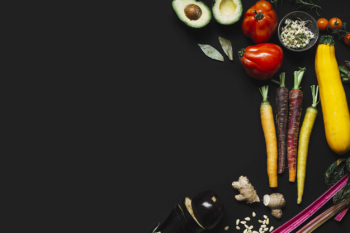 Elevated view of fresh vegetables on black backdrop Elevated view of fresh vegetables on black backdrop