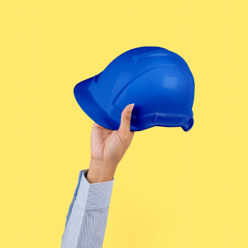 Engineer hard hat held by a hand jobs and… | Free stock photo | High Resolution image