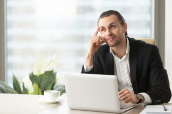Entrepreneur imagines positive result of work Entrepreneur imagines positive result of work