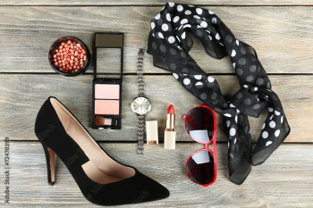 Essentials fashion woman objects on wooden background Essentials fashion woman objects on wooden background