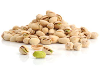 Extreme close-up image of pistachio with more pistachios in background