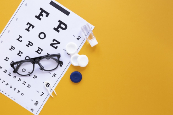 Eye care products on orange background with copy space Free Photo