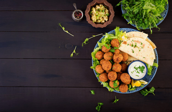 Falafel, hummus and pita. middle eastern or arabic dishes . halal food. top view. copy space Free Photo