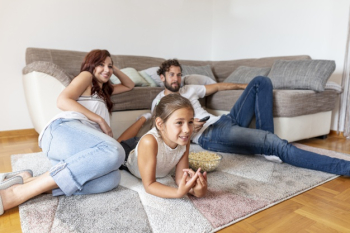 Family laying on the floor while watching tv Free Photo Family laying on the floor while watching tv Free Photo