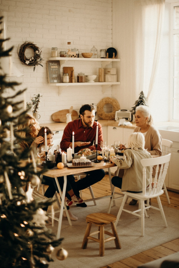 Family Sitting Near Dining Table and Eating Food Family Sitting Near Dining Table and Eating Food