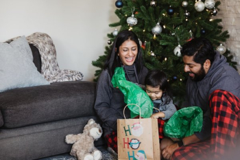 Family Unwrapping Holiday Gifts Family Unwrapping Holiday Gifts