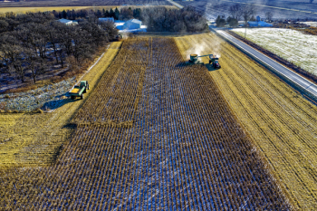 Farm Tractor Harvesting on Field Farm Tractor Harvesting on Field