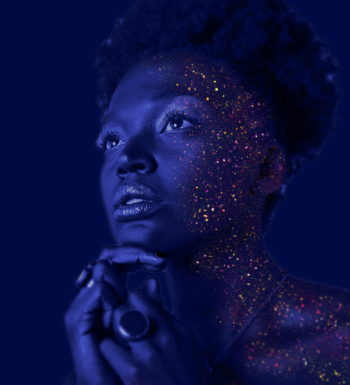 Fashion Photography of Woman Hands on Chin With Glitter Makeup