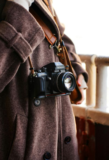 Fashionable Photographer with Classic Camera Fashionable Photographer with Classic Camera