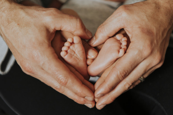 Father and baby forming a heart shape Father and baby forming a heart shape