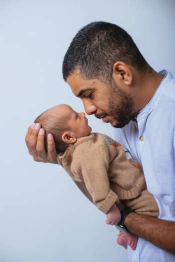 Father Embracing Newborn Baby Father Embracing Newborn Baby