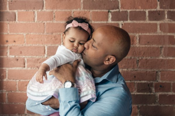 Father Gives Baby Daughter A Kiss Father Gives Baby Daughter A Kiss