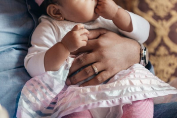 Father Holding Baby Daughter In Lap Father Holding Baby Daughter In Lap