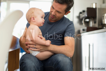 Father holding baby son Father holding baby son