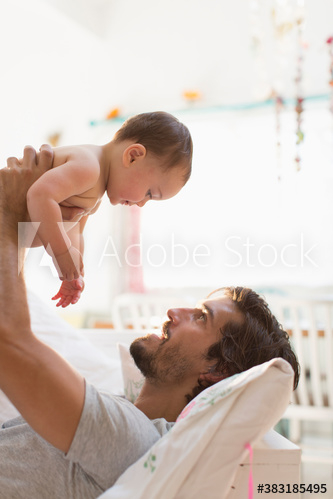 Father lifting baby son Father lifting baby son