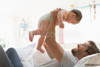 Father lifting baby son Father lifting baby son