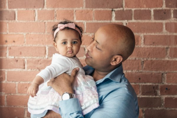 Father Looking Lovingly At Baby Daughter Father Looking Lovingly At Baby Daughter