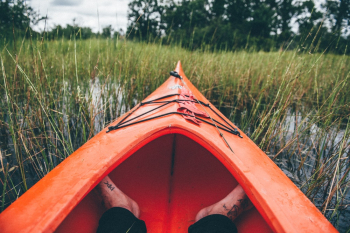 Feet on Red Kayak Boat Feet on Red Kayak Boat