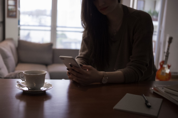 Female holding an iPhone 8 Plus Female holding an iPhone 8 Plus